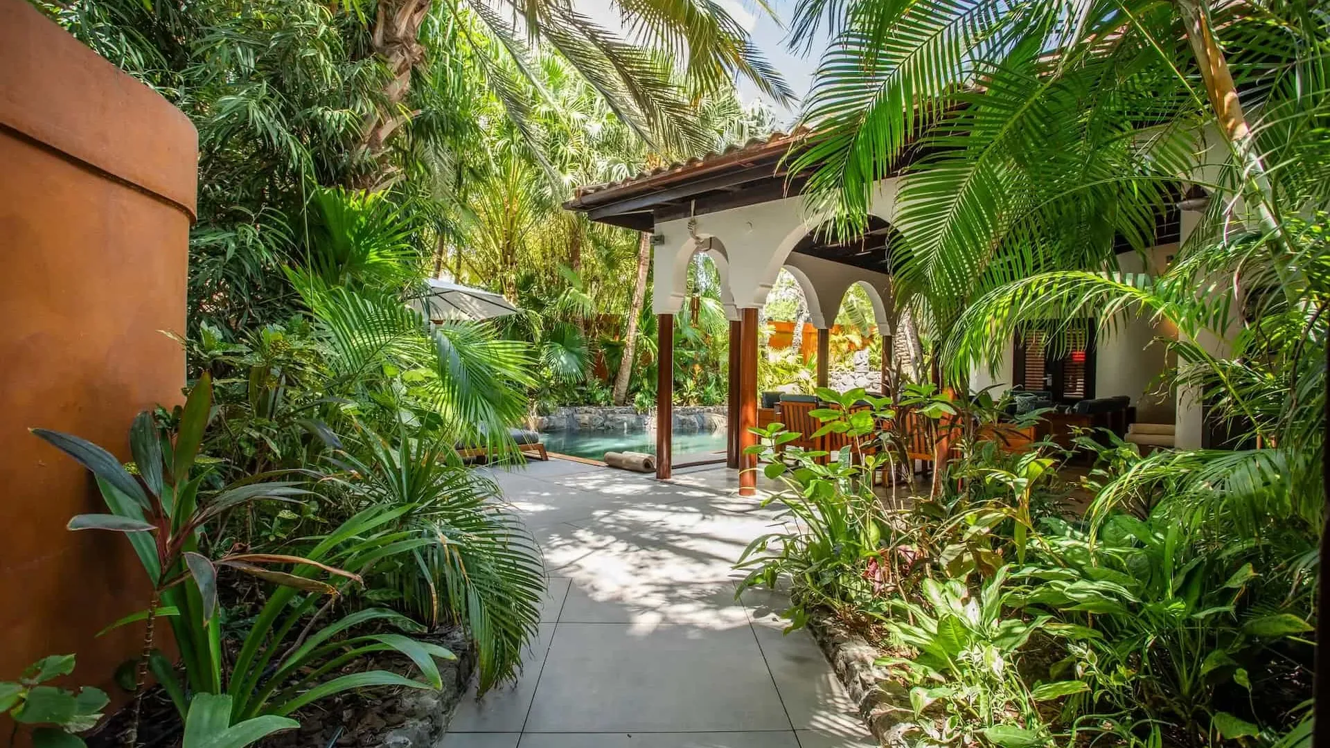 Property maintenance and caretaking in Santa Teresa Costa Rica — villa exterior in warm afternoon light