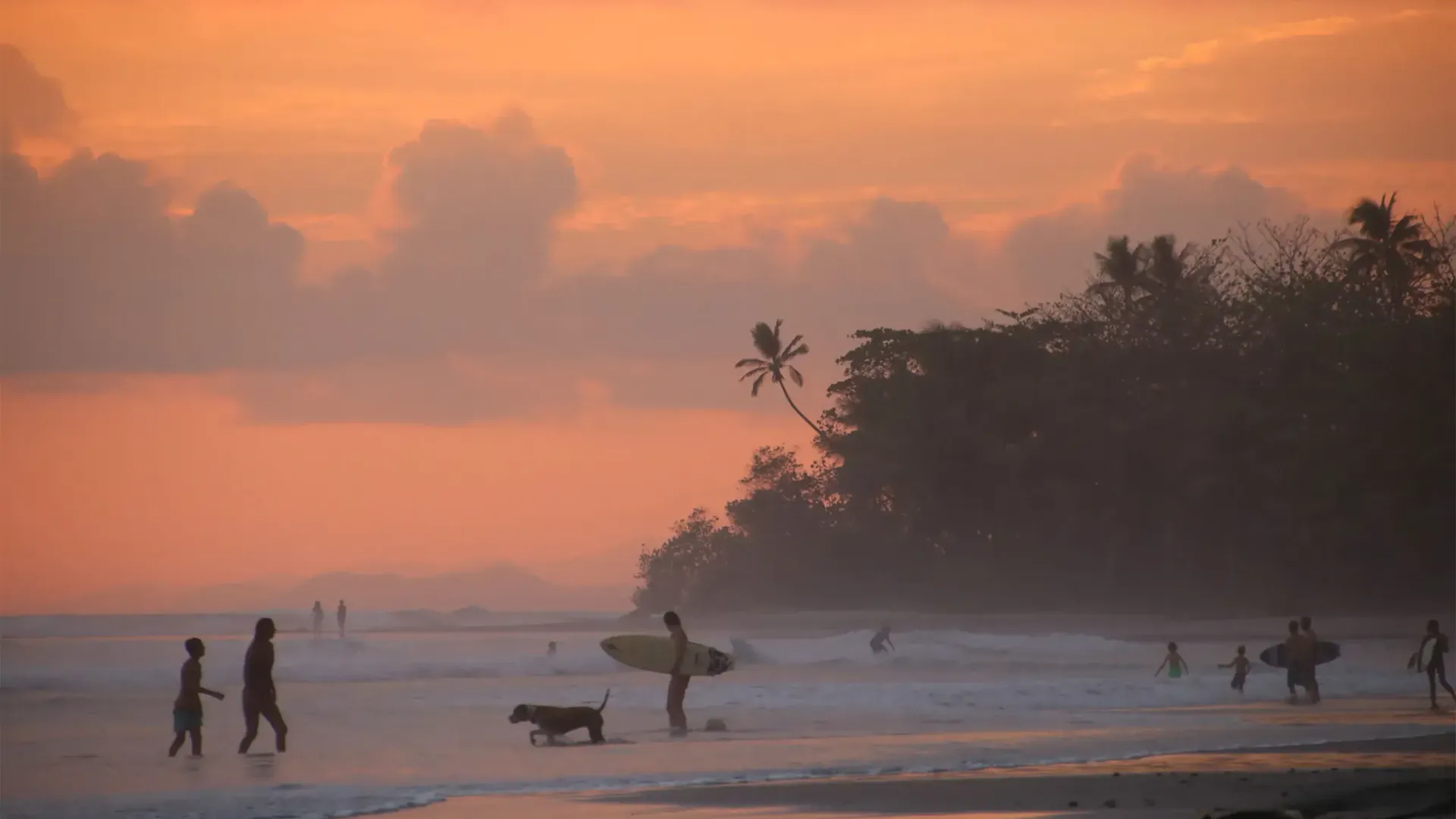 Costa Rica beach at sunset — Santa Teresa coastline with warm golden light