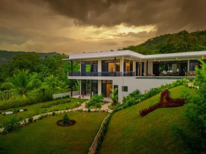 Costa Rica villa entrance gate with tropical garden — property maintenance and caretaking in Santa Teresa