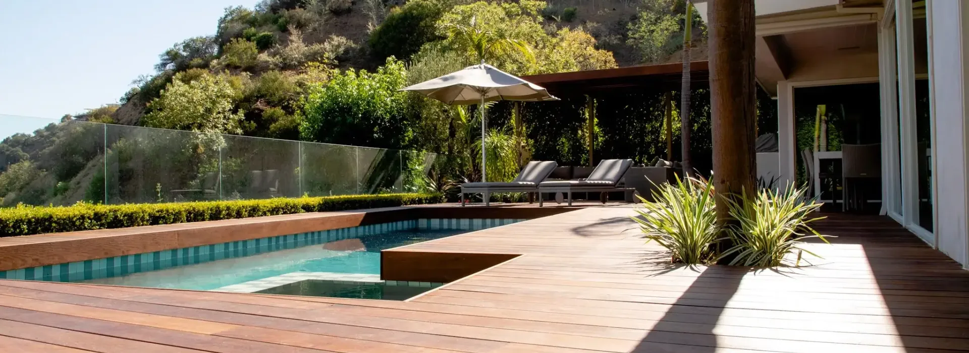 Restored wood deck and pool area at a tropical Costa Rica villa in warm afternoon light