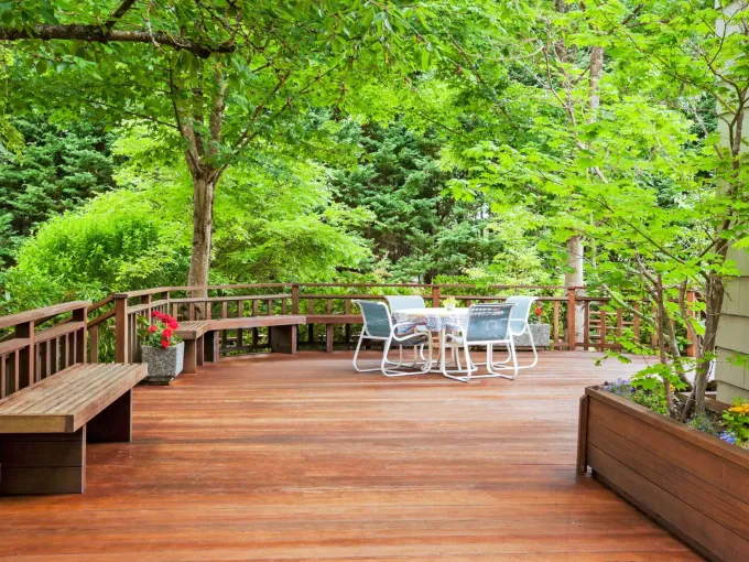 Property inspection detail — timber deck surface and rendered wall at a Costa Rica villa